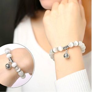 Charm bracelet white opal beads and titanium